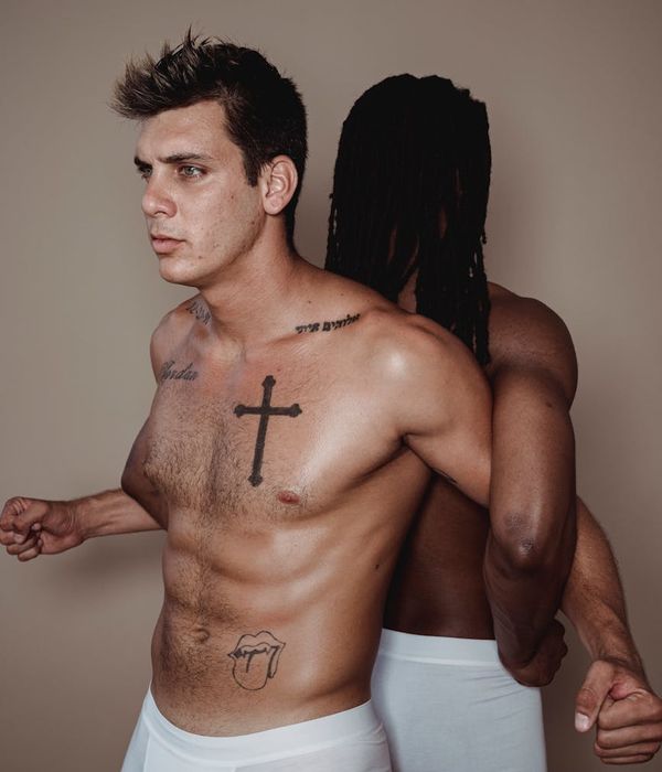 Man performing a controlled strength exercise in a minimalist gym setting.